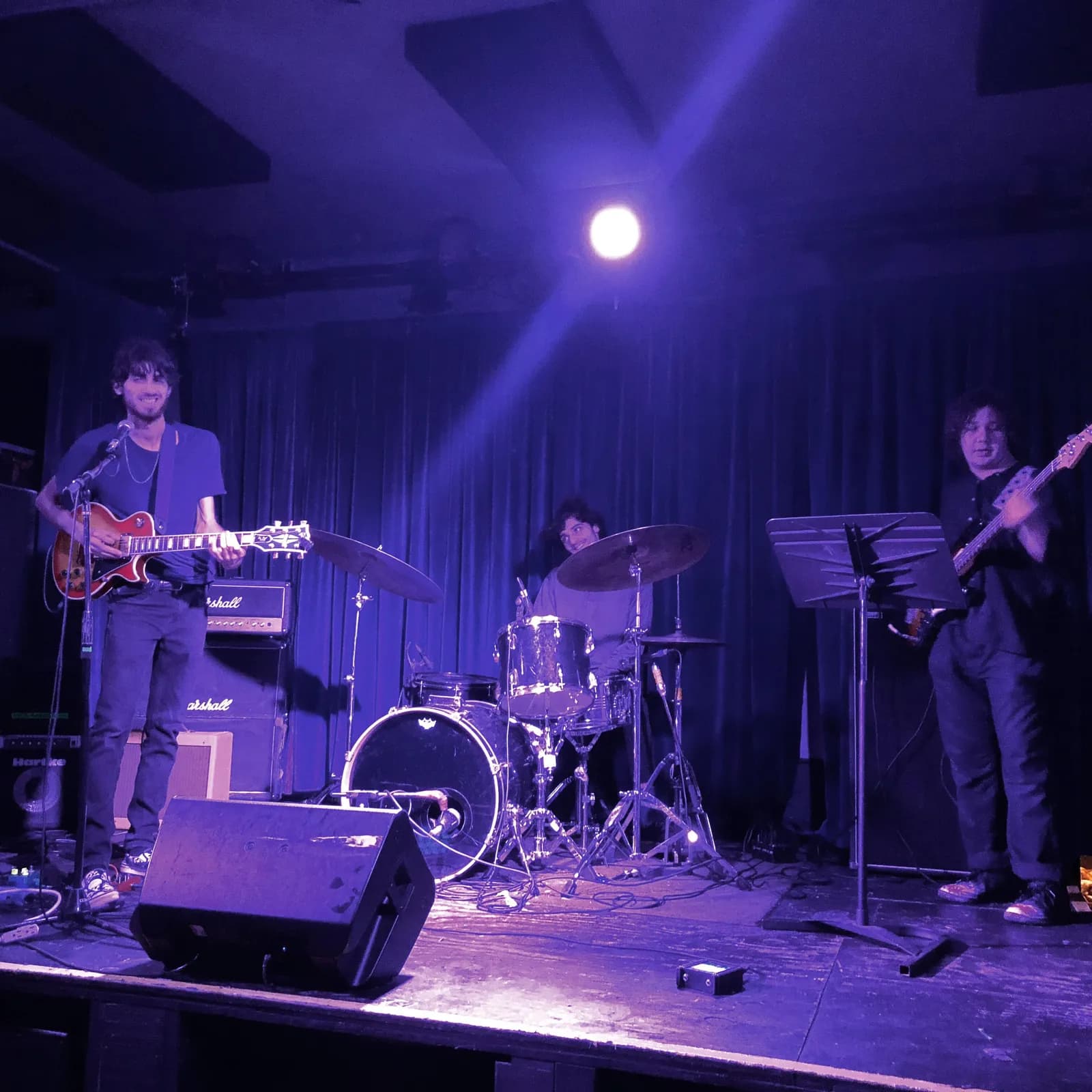Warren Galea performing with a quartet on a purple-lit stage