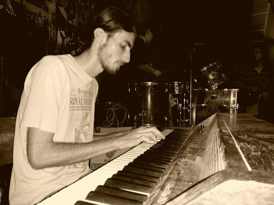 Warren Galea playing keyboard during a rehearsal